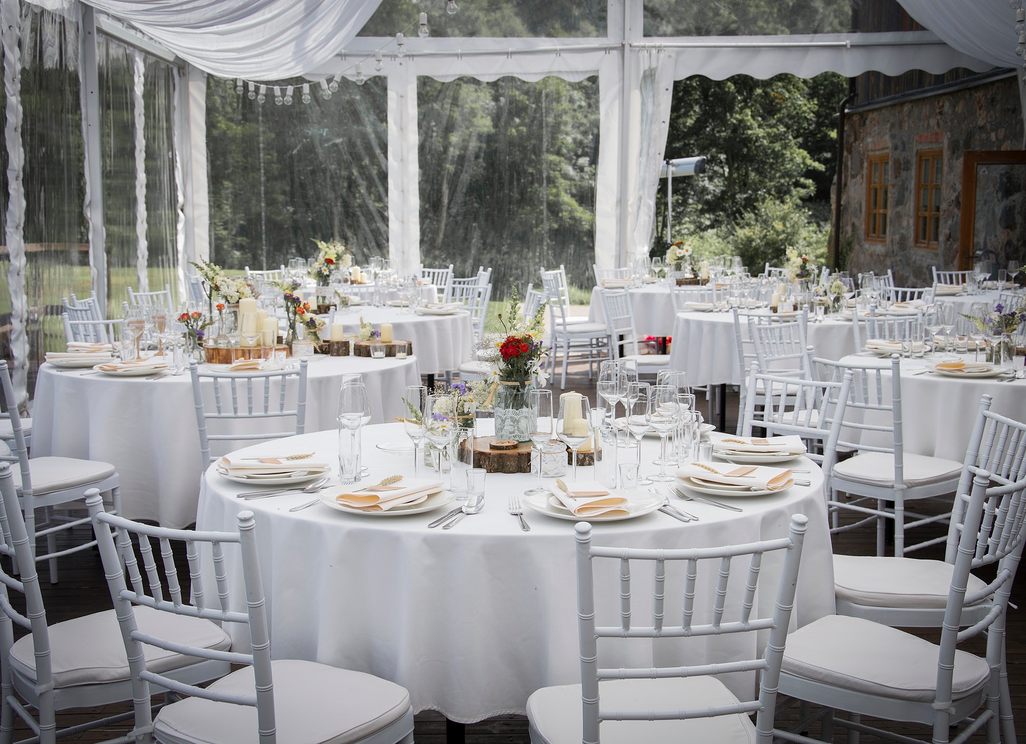 wedding party table with champagne glasses and white table setting